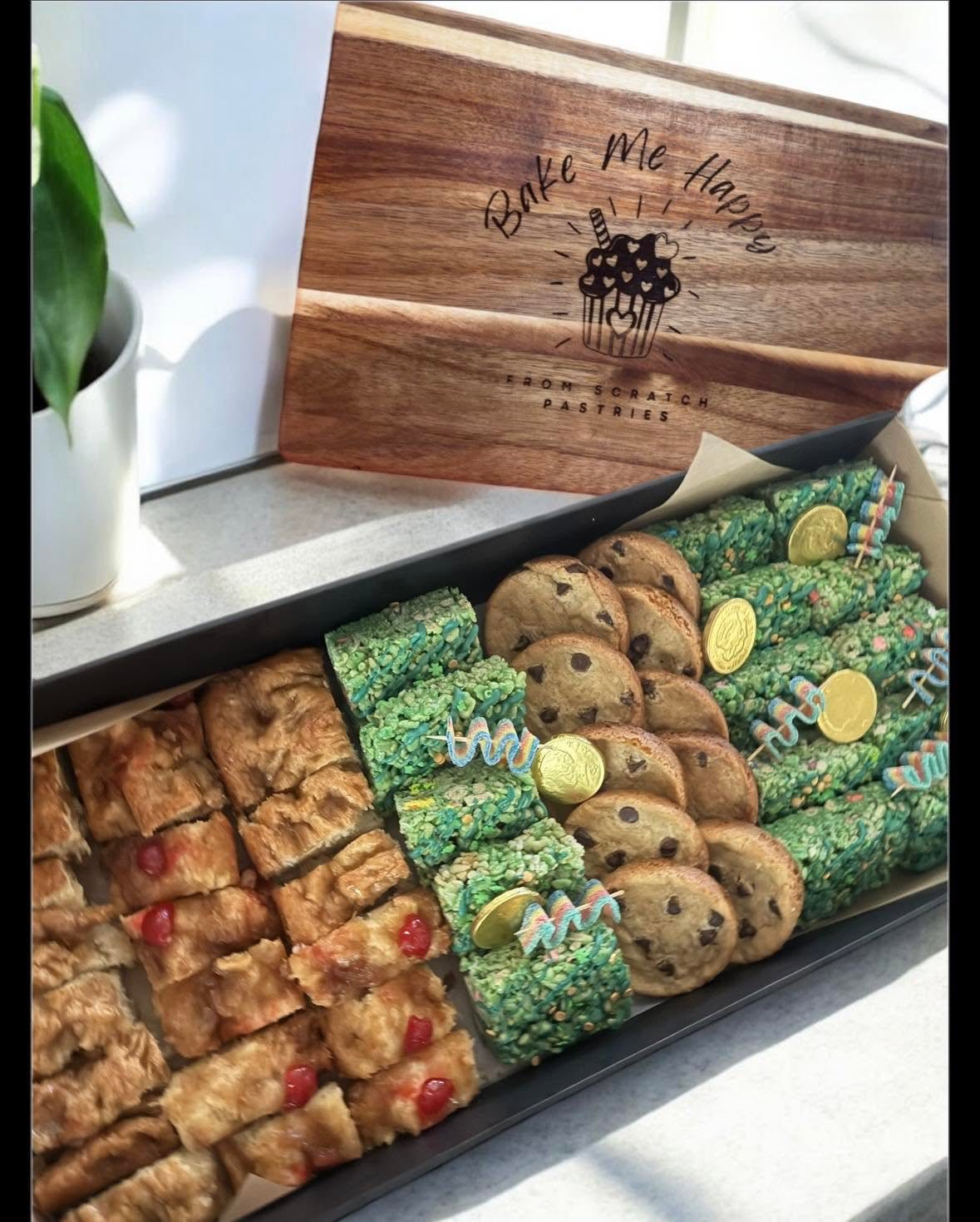 A signature Bake Me Happy pastry box